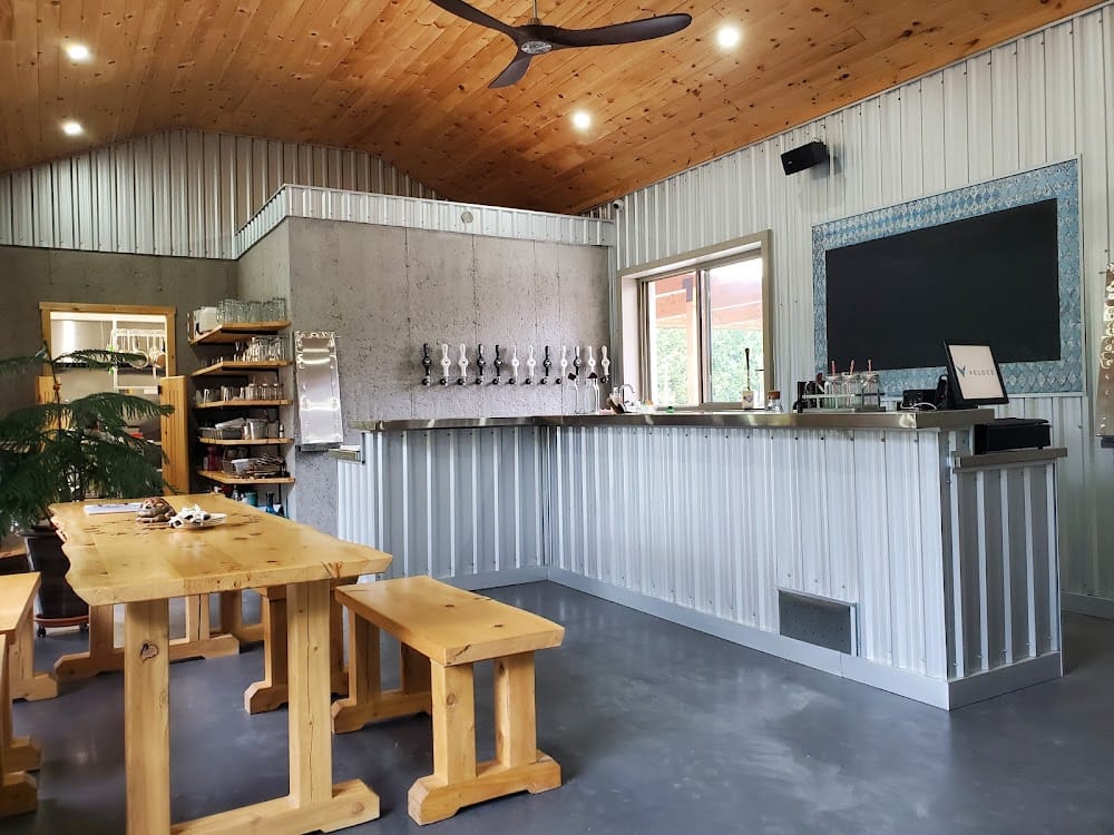 Inside the Brauwerk Hoffman taproom: bar, taps, and timber tables